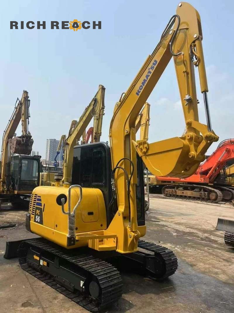 Hydraulic hoses and linkage of a 2017 Komatsu PC56-7 excavator, 1,900 hours, $11,111